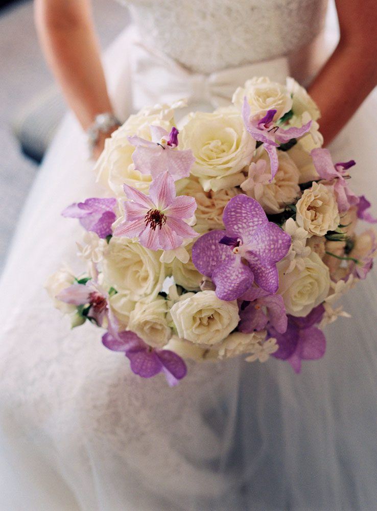 The bride is holding a beautiful bouquet of flowers