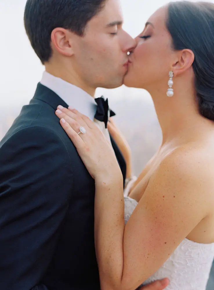 The bride and the groom share an intimate kiss