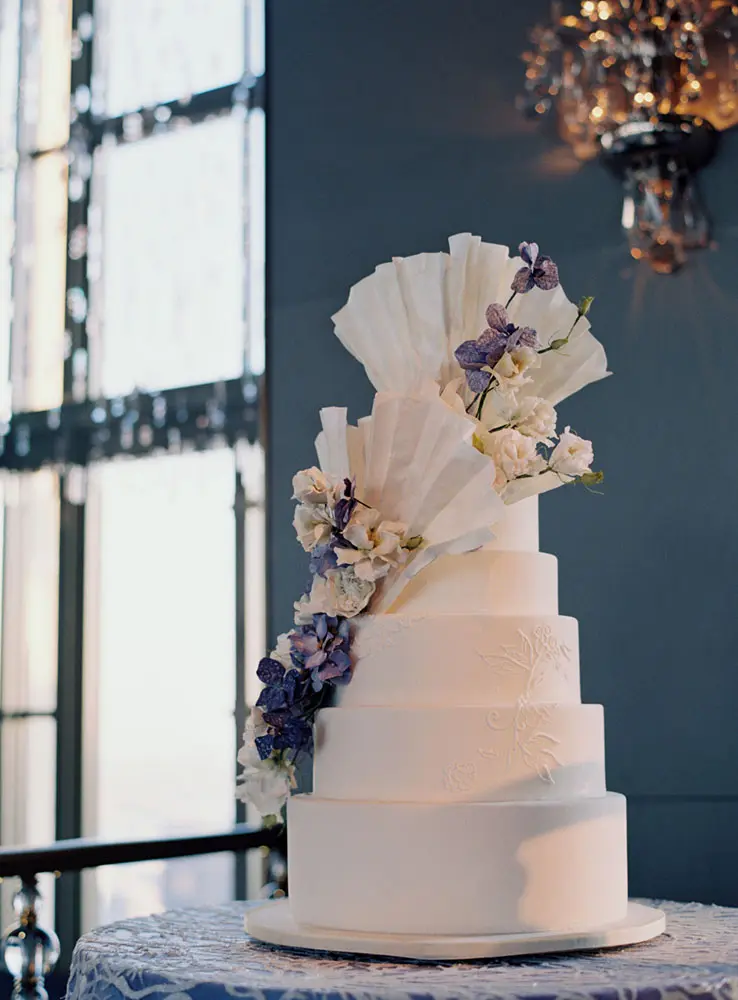 The wedding cake stands in full grandeur