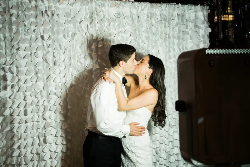A passionate kiss between the bride and the groom
