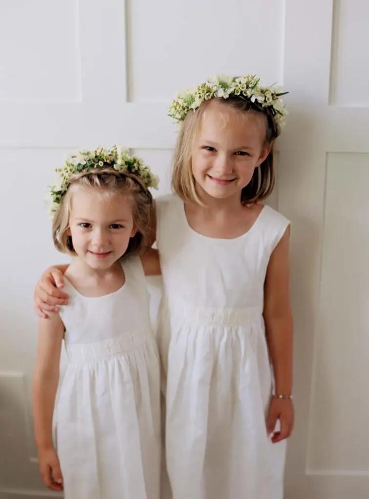 Two beautiful girls attending the wedding ceremony