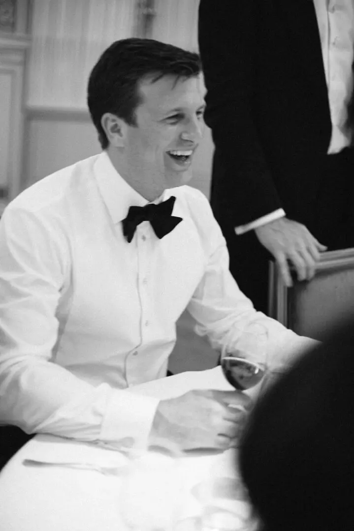 The groom is in delighted mood after the wedding