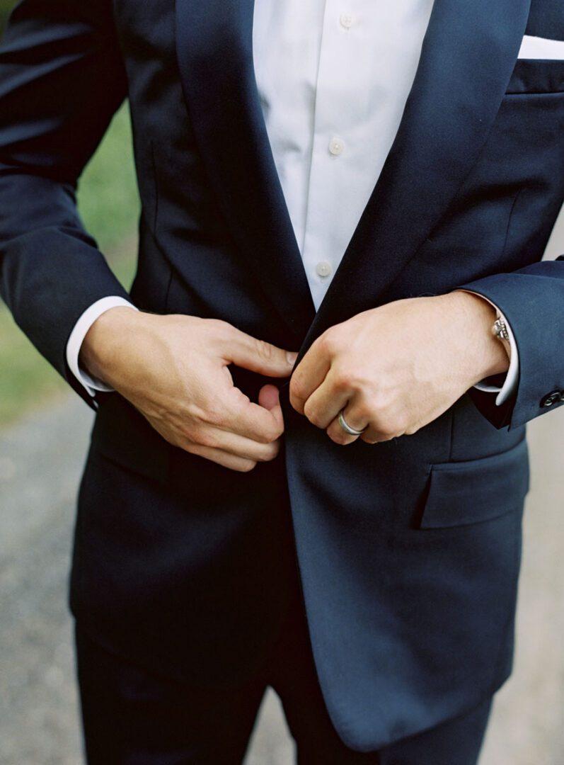 The close shot of the wedding tuxedo of the groom