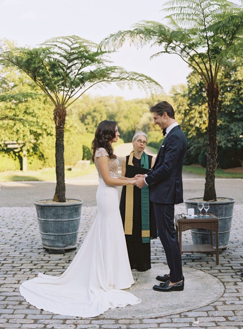The bride and the groom exchanging vows at the wedding