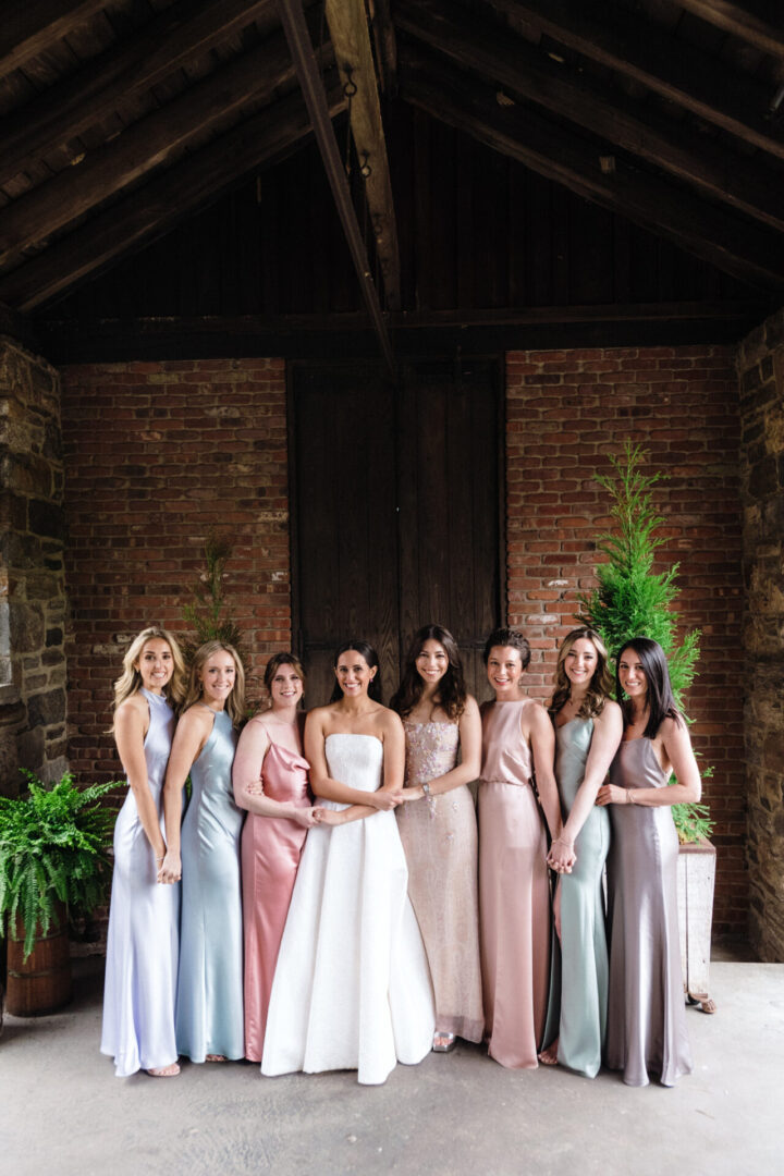 The bride poses for a photo with her friends