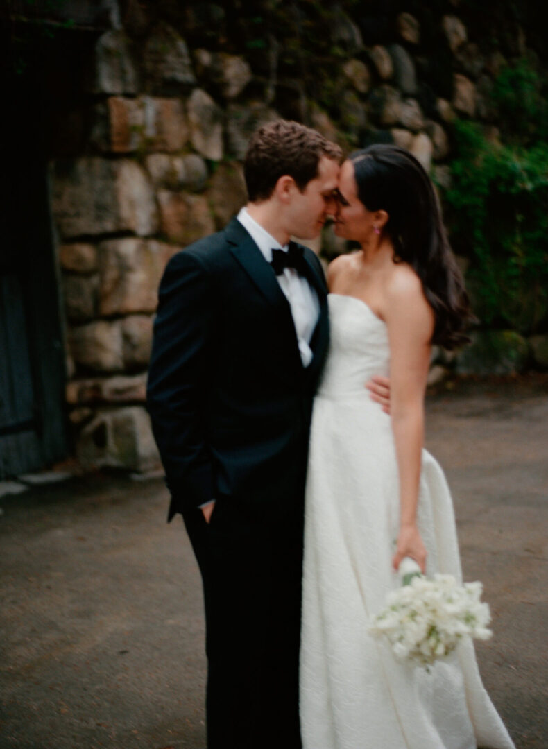The bride and the groom kiss each other tenderly