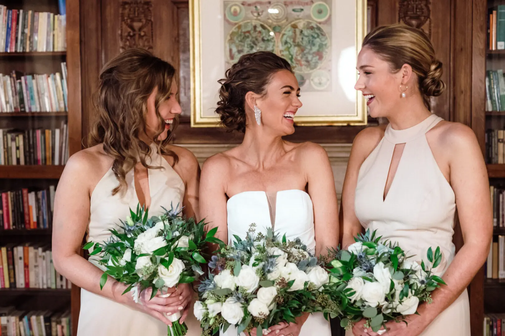 The bride enjoys a conversation with her maids of honor