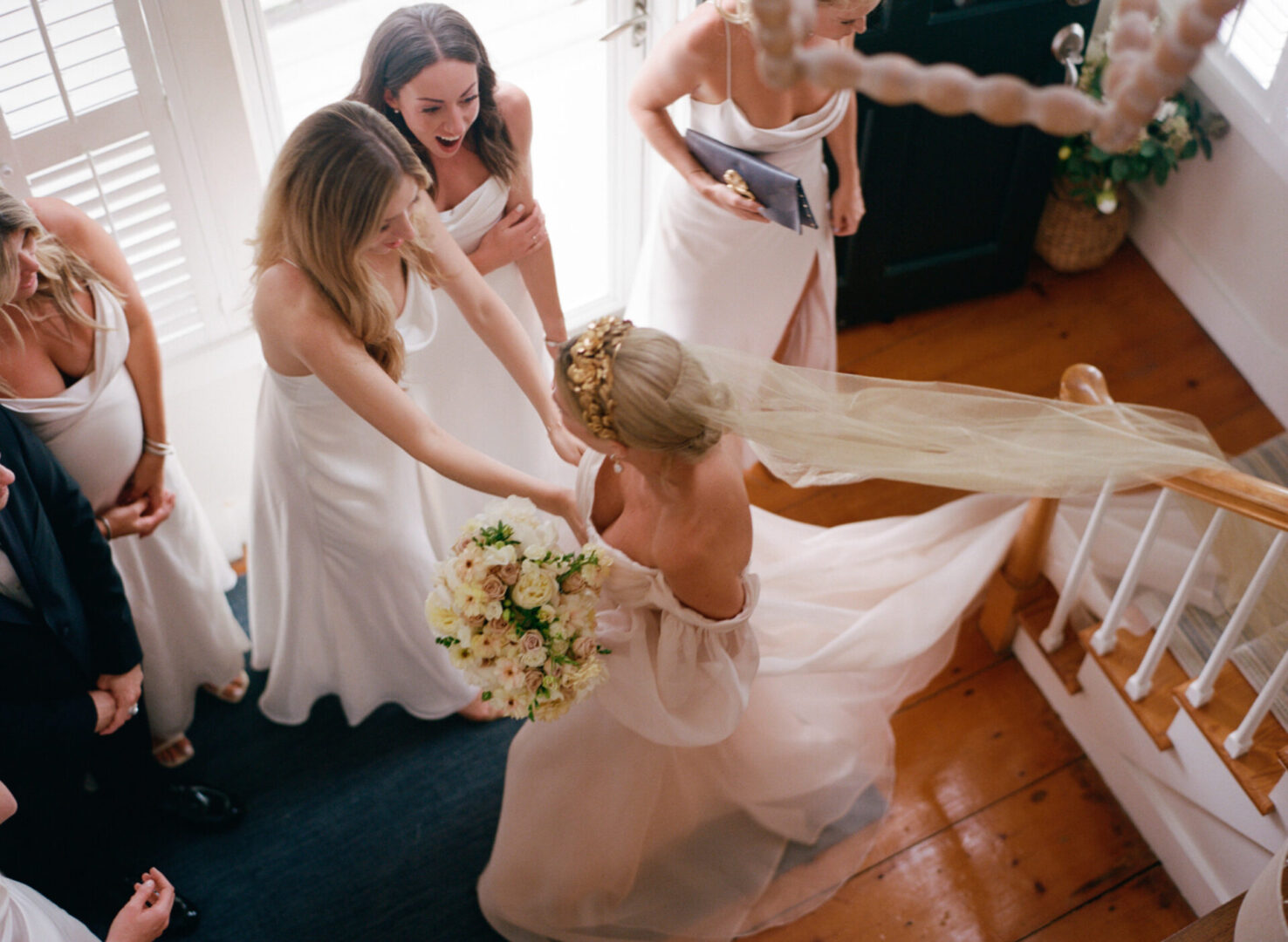 The bride is welcomed by her maids of honor