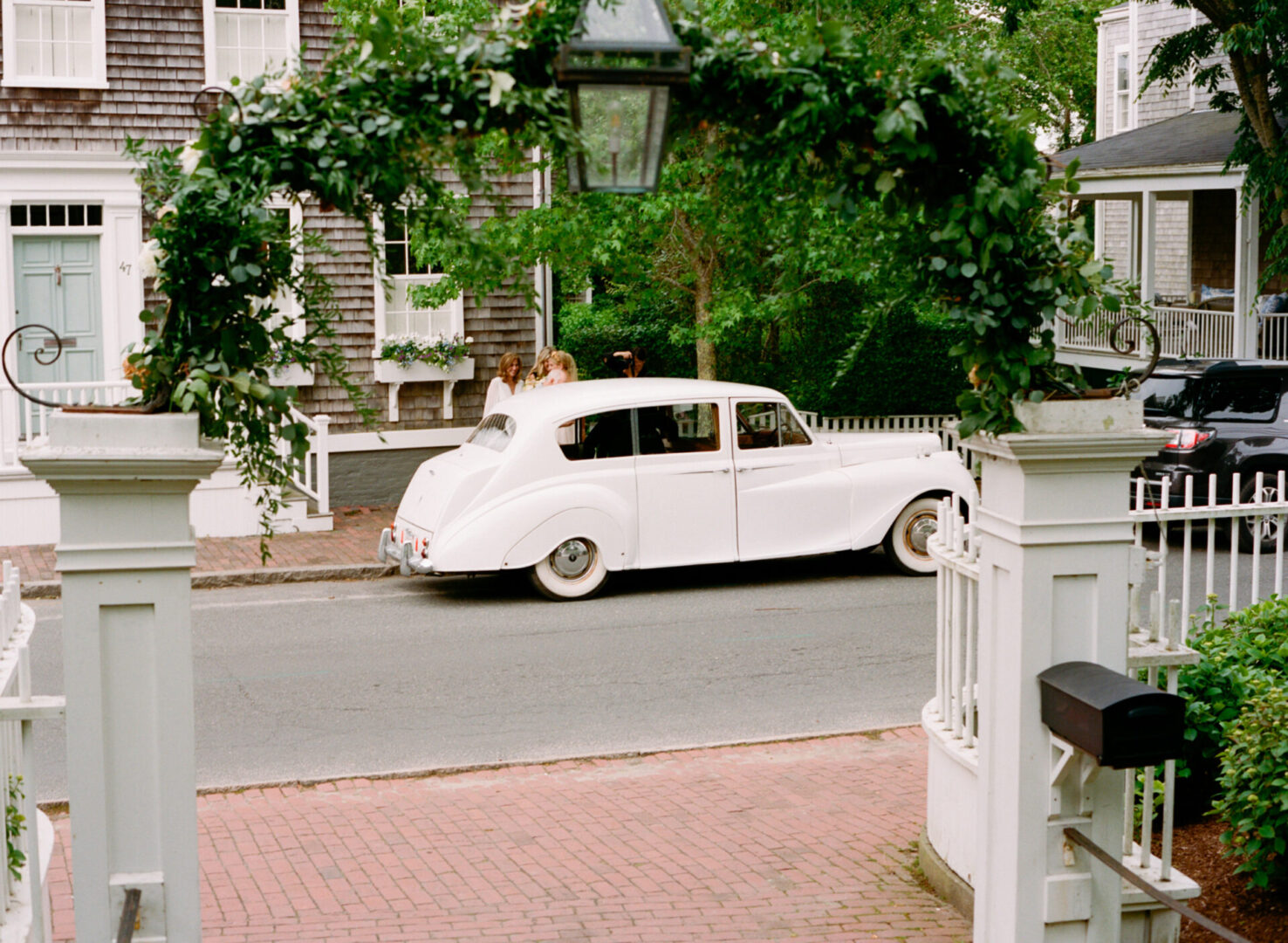 A vintage white car was used for the ceremony
