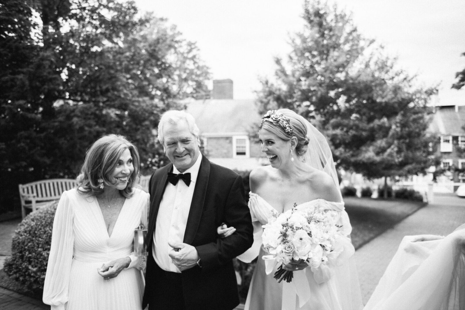 A candid moment between the bride and her parents