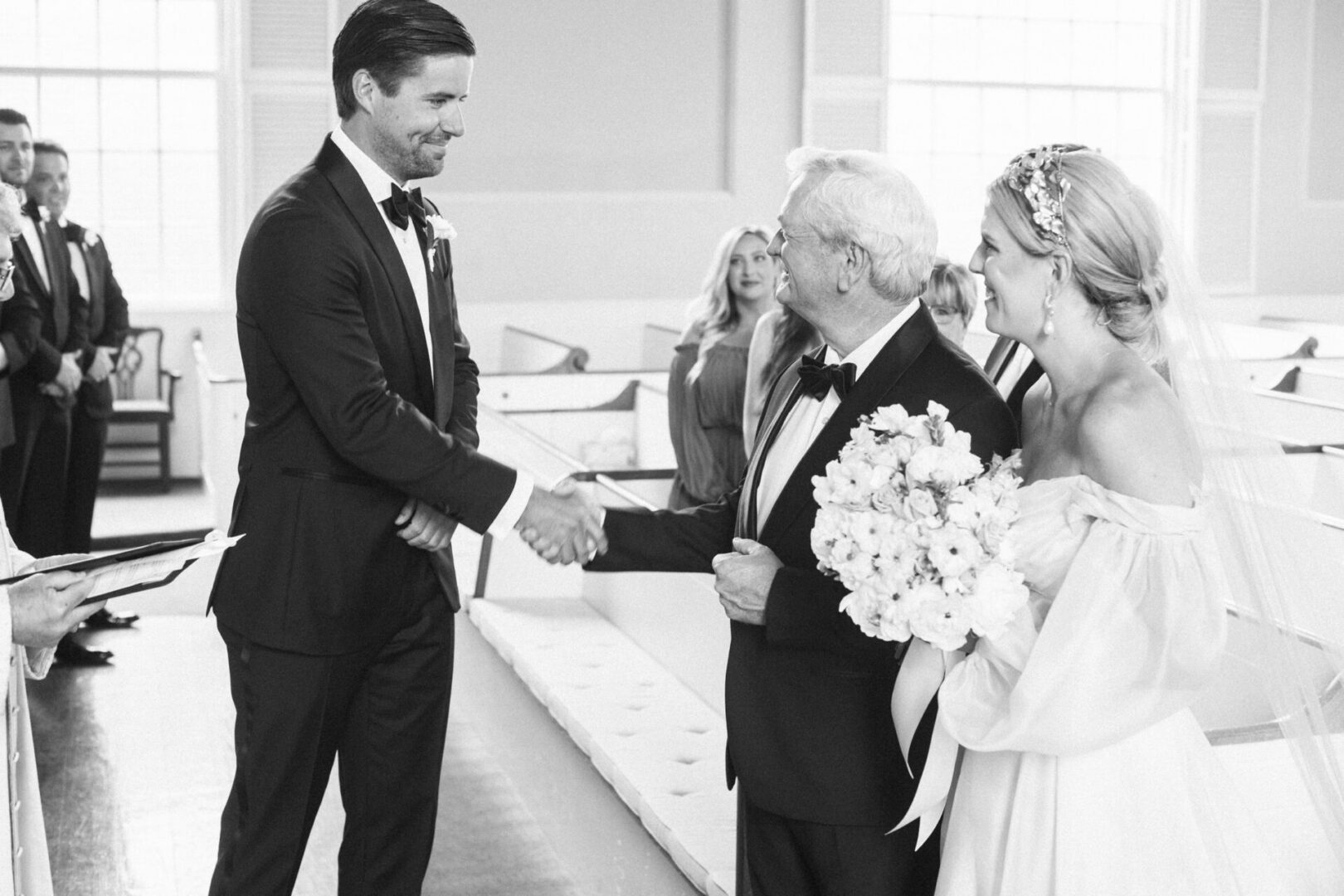 The groom is formally welcomed by the father of the bride