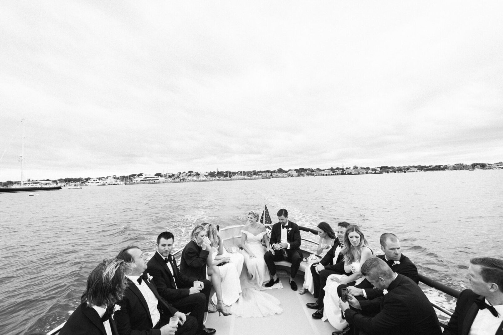 The bridal couple and friends enjoy the boat ride
