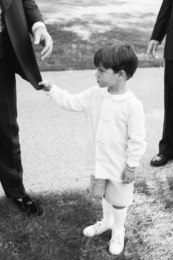 A young boy has a curious look at the wedding
