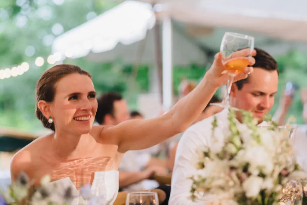 The bride acknowledges a toast made for her