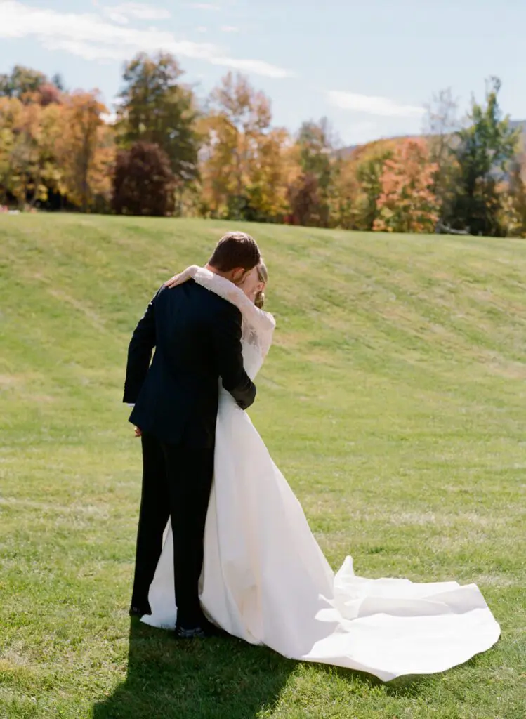 Groom and the bride kissing each other in a farm