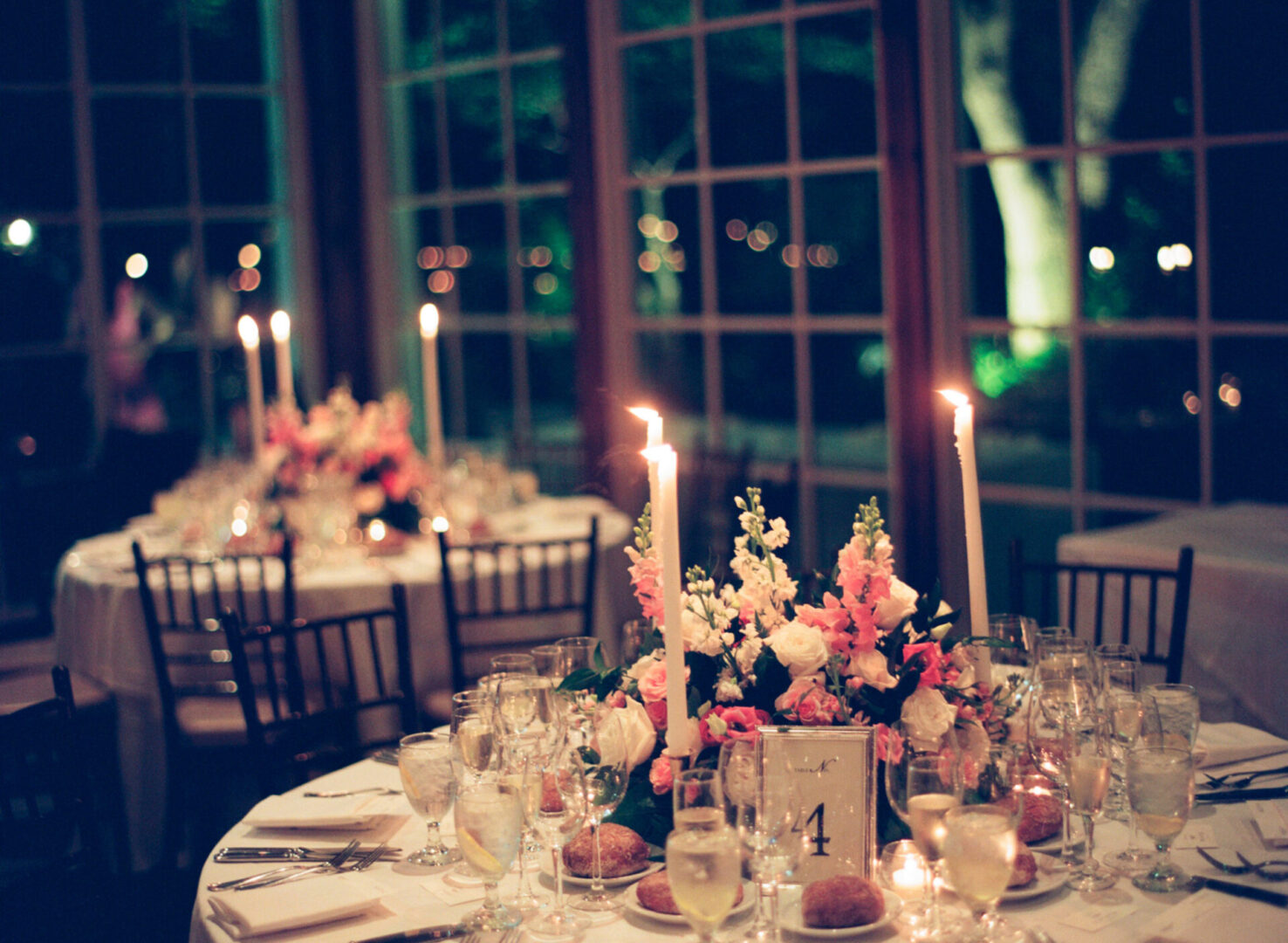 Decorated wedding tables with food and candles