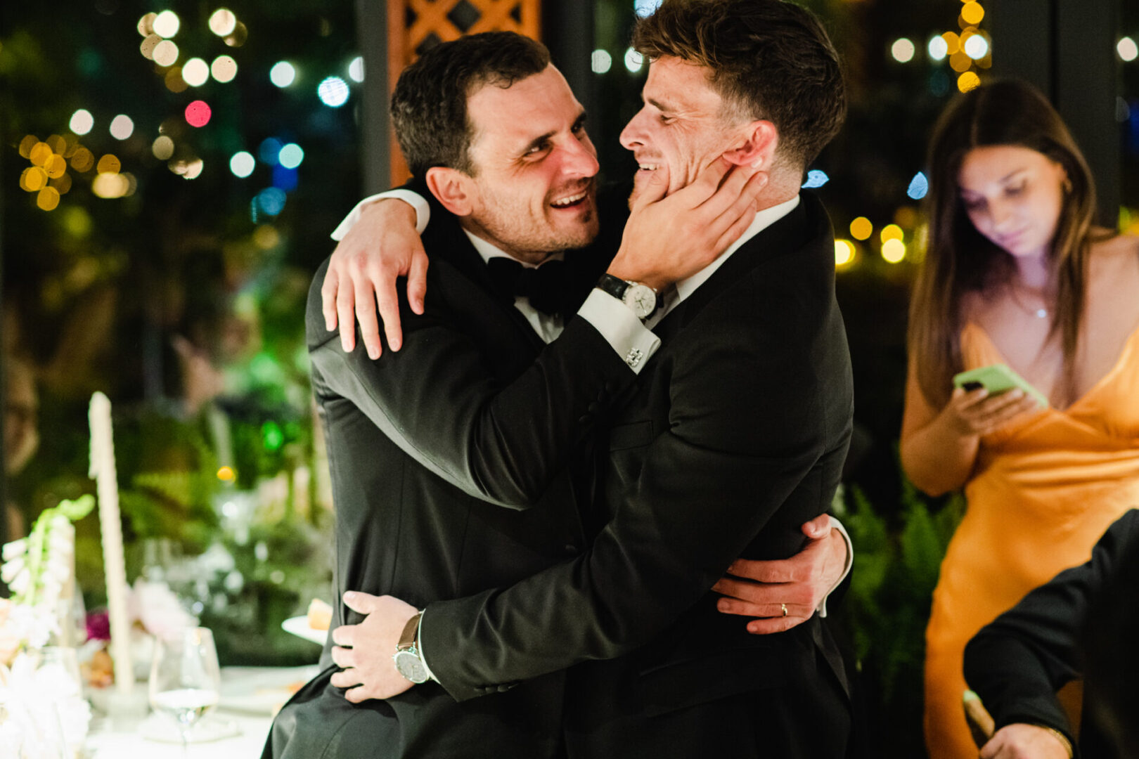Wedding guests hugging each other