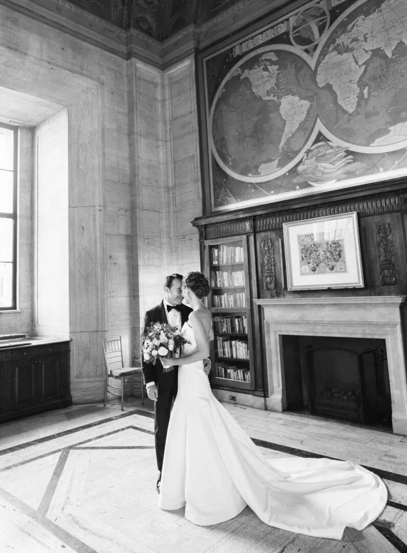 Black and white picture of a couple standing in a hall
