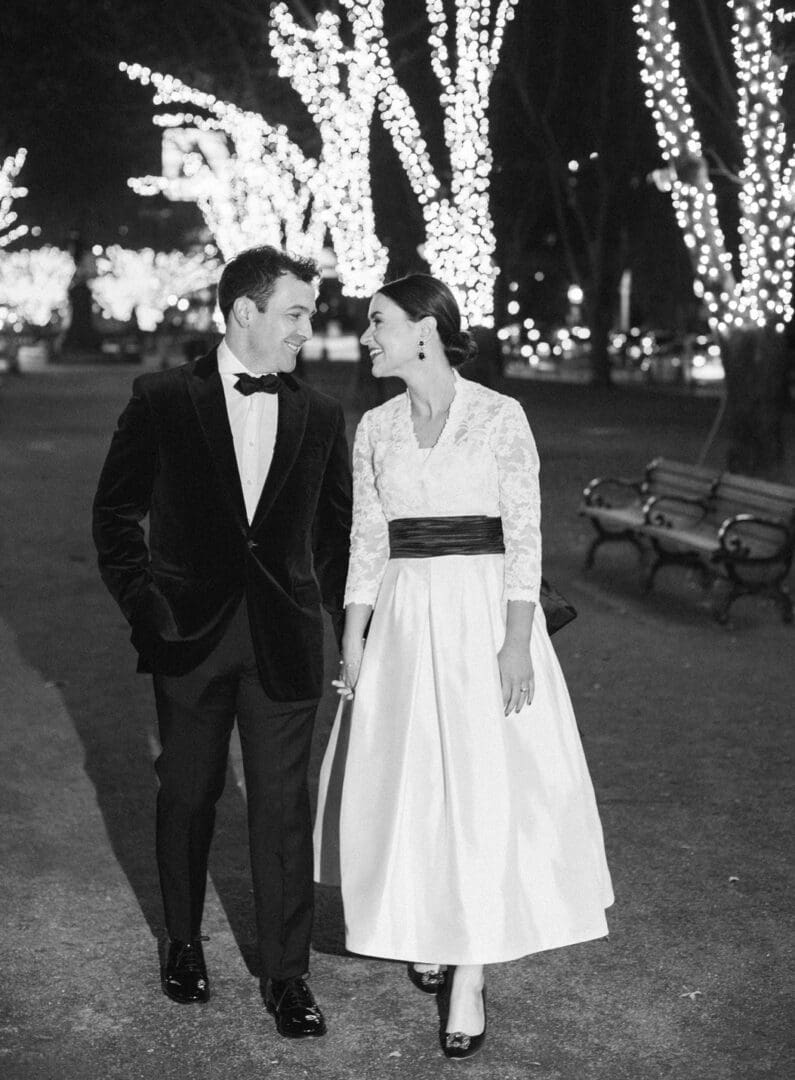 Black and white picture of a couple standing in a park