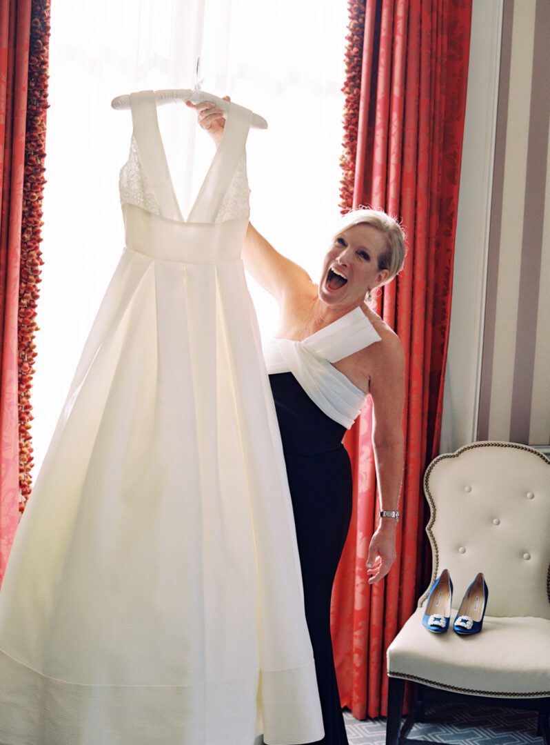 Bride showing the wedding dress in happiness