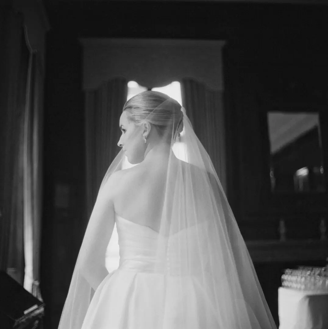 Back image of a bride in white dress