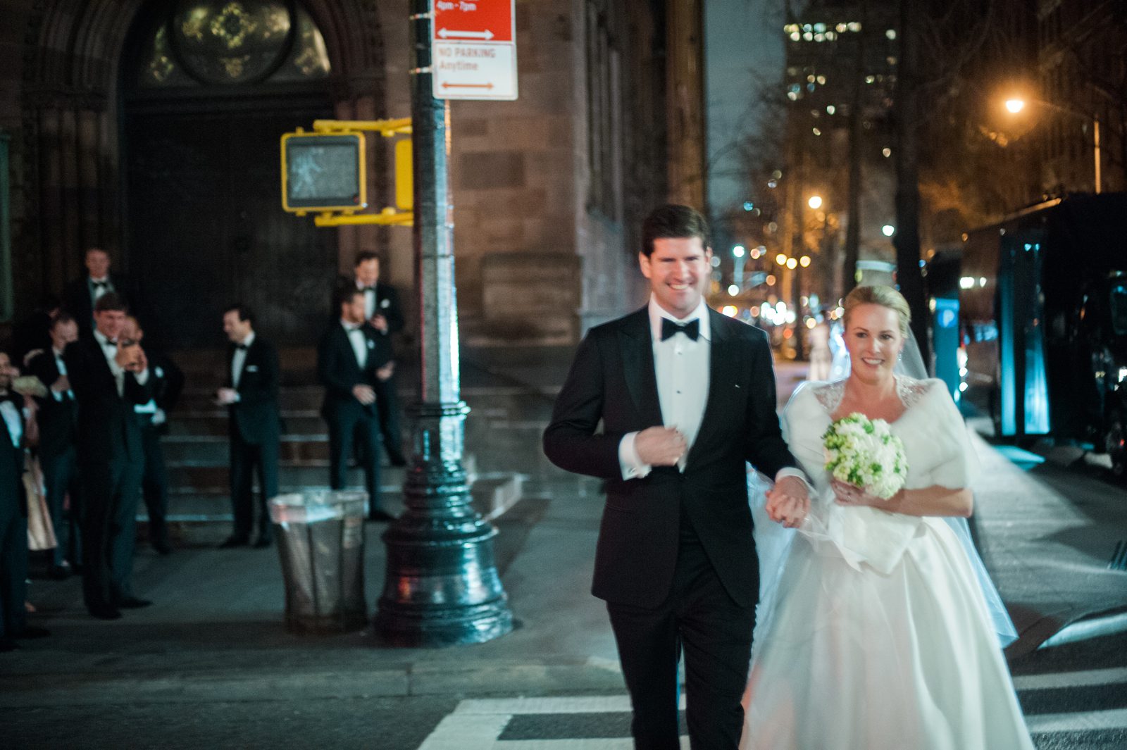 The bride and the groom walking on the street