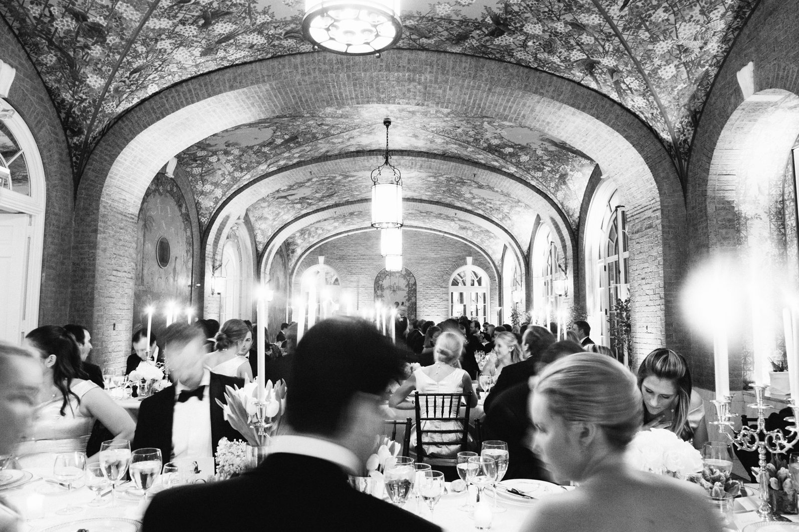Black and white image of people at the wedding