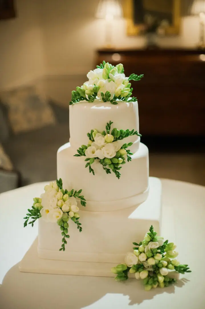 A beautiful white color cake at the table