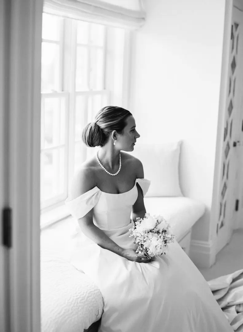 Black and white image of a bride posing