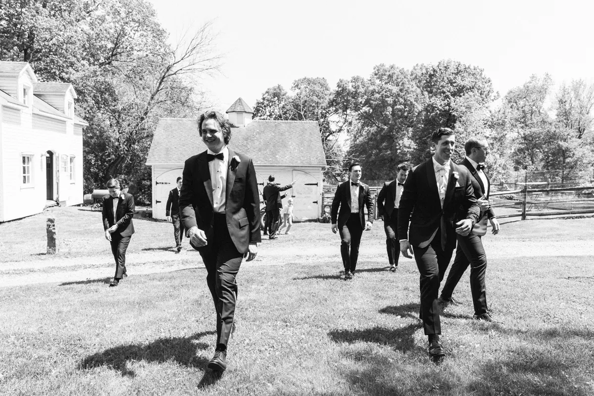 Group of men wearing coat moving in the field