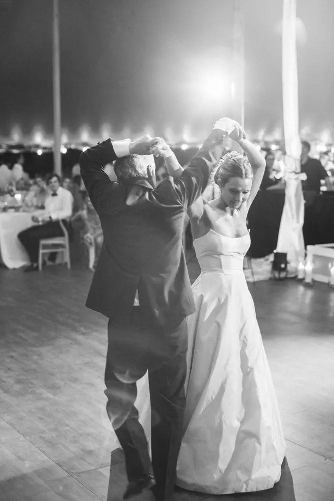 Black and white image of some people dancing in wedding