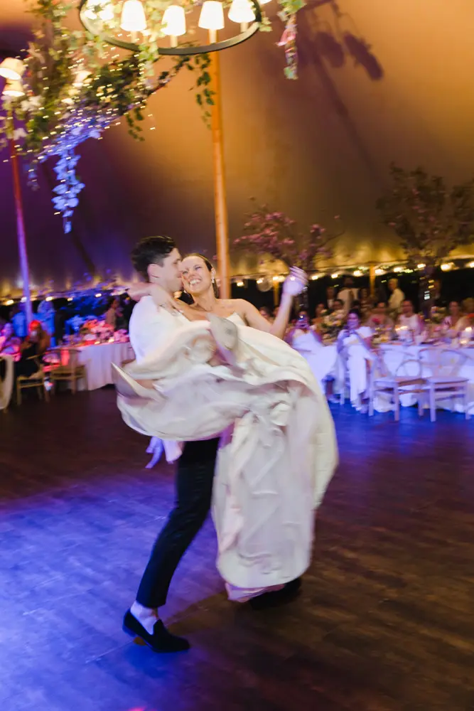 The bride and the groom dancing in their wedding party