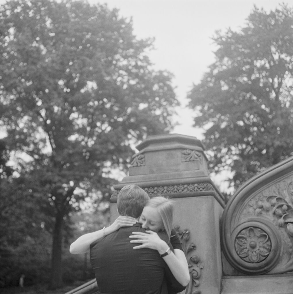 Black and white image of a couple hugging