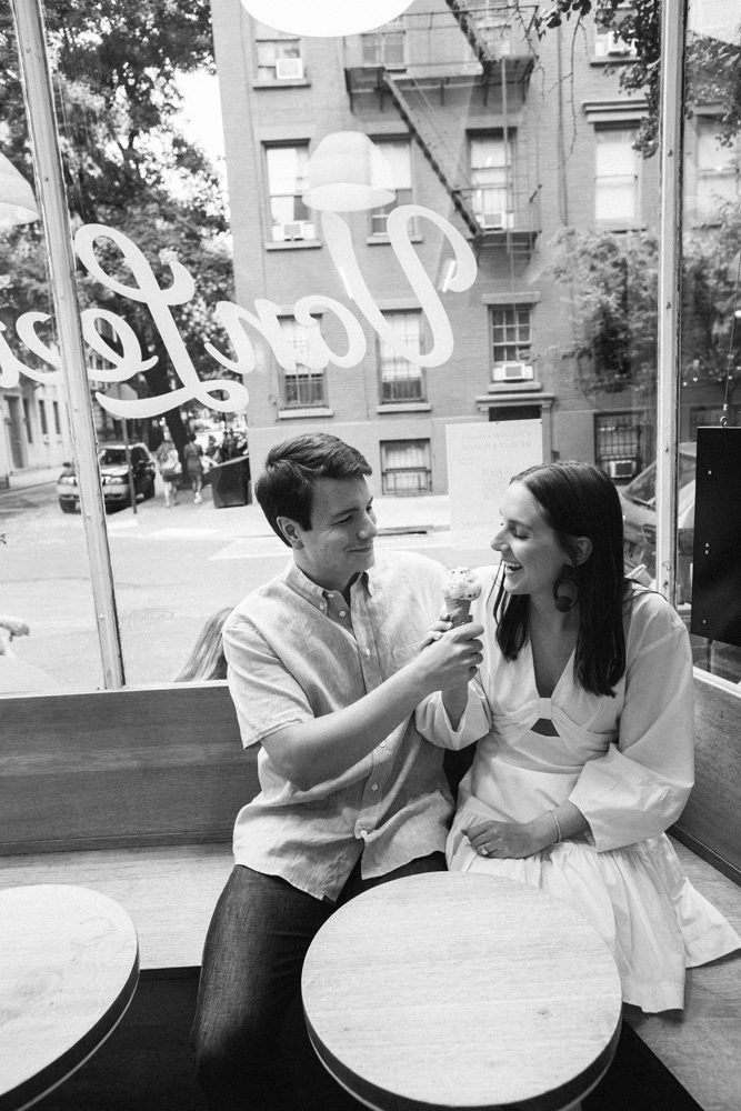 Black and white image of a couple eating ice cream