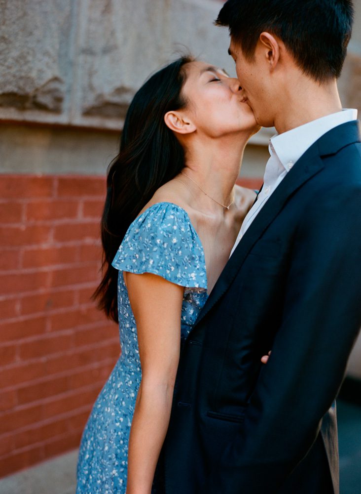 A couple posing while kissing