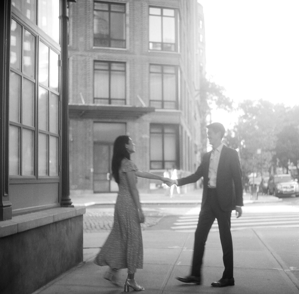 Black and white image of a couple on the street