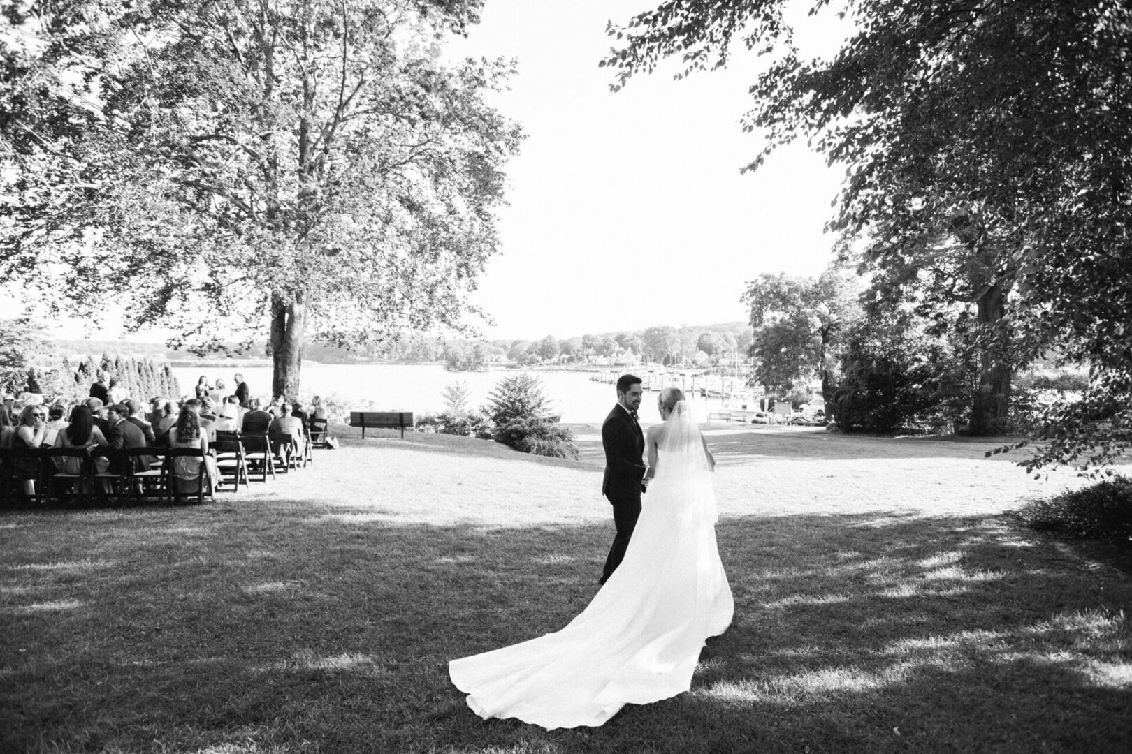 Newlywed couple walking holding each other hand