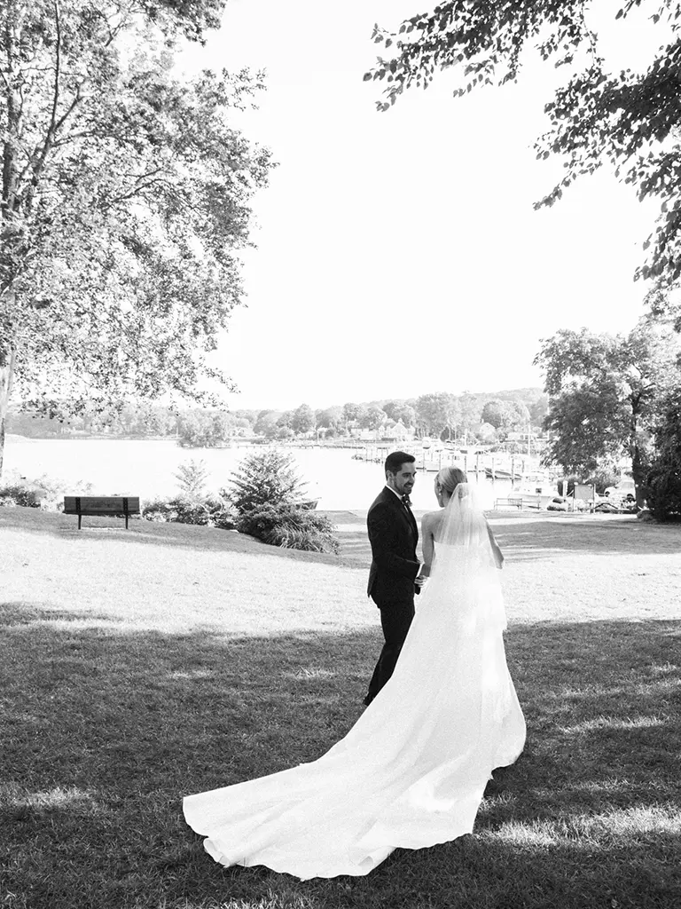 Newlywed couple walking holding each other hand